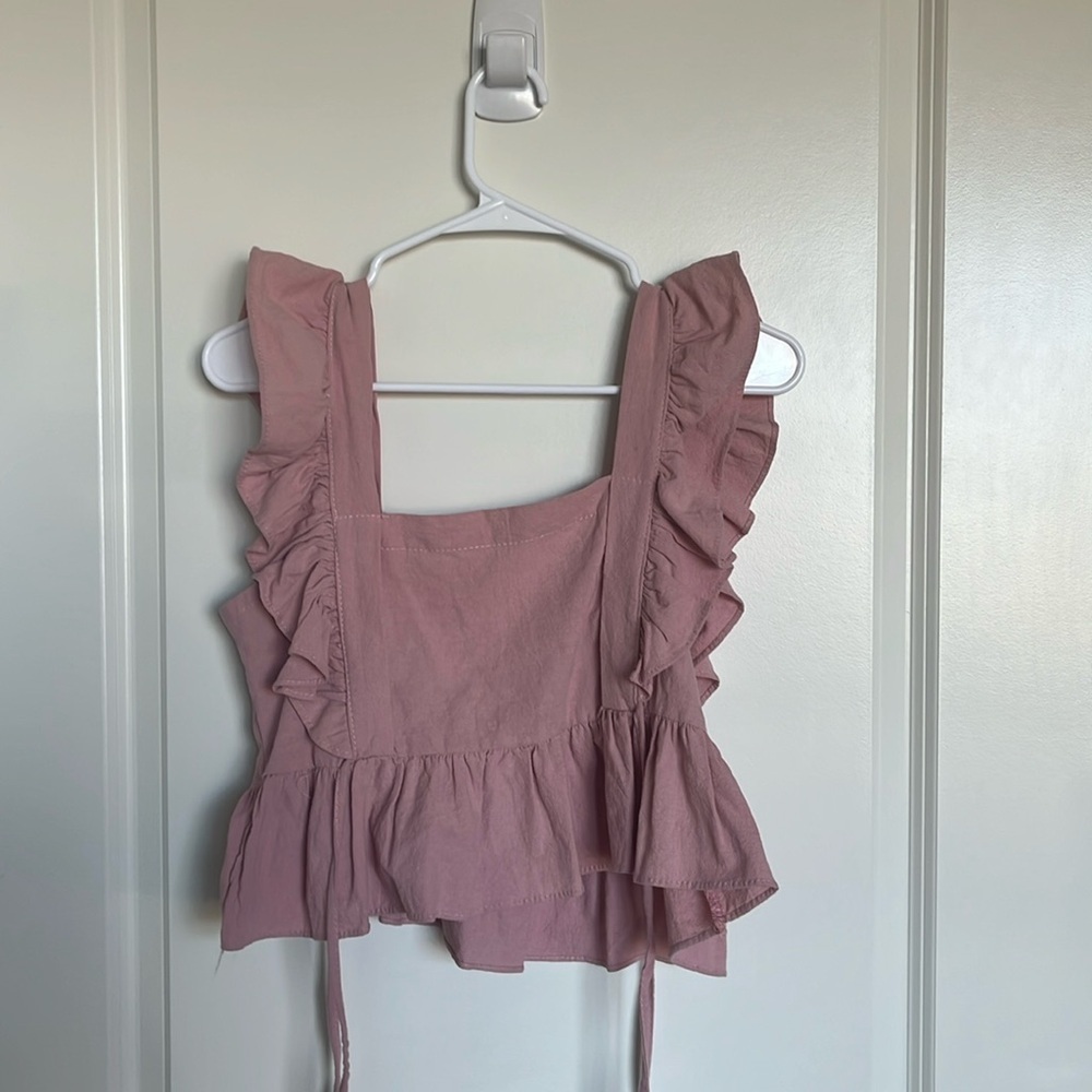 Frilly pink tank top with side ties
Same look on both front and back